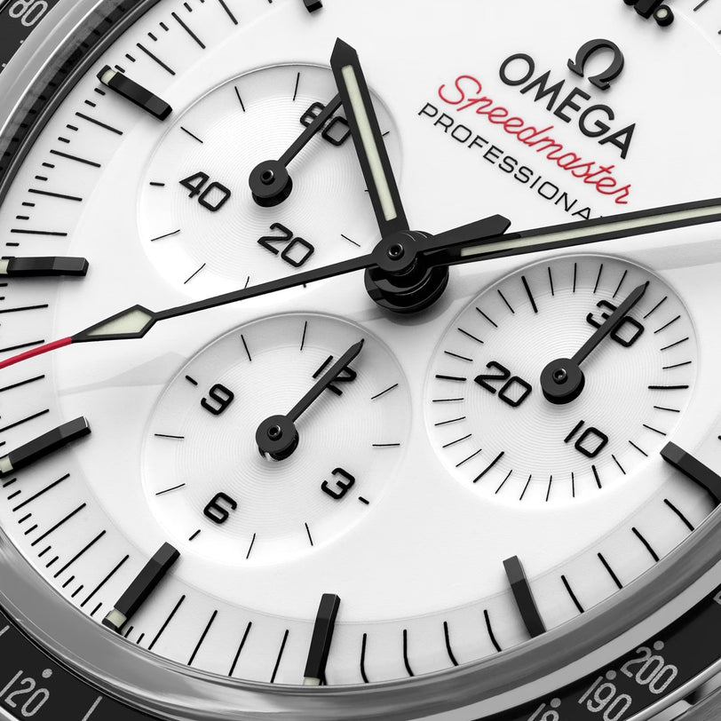 Close-up of the OMEGA Speedmaster Moonwatch Professional featuring a white dial, black hour markers, three subdials, and the Speedmaster Professional branding.