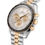 A close-up of the OMEGA Speedmaster Moonwatch Professional Moonshine, showcasing a silver and gold bracelet, gold pushers, a white dial with three subdials, a tachymeter bezel, and powered by the advanced Omega 3861 calibre.