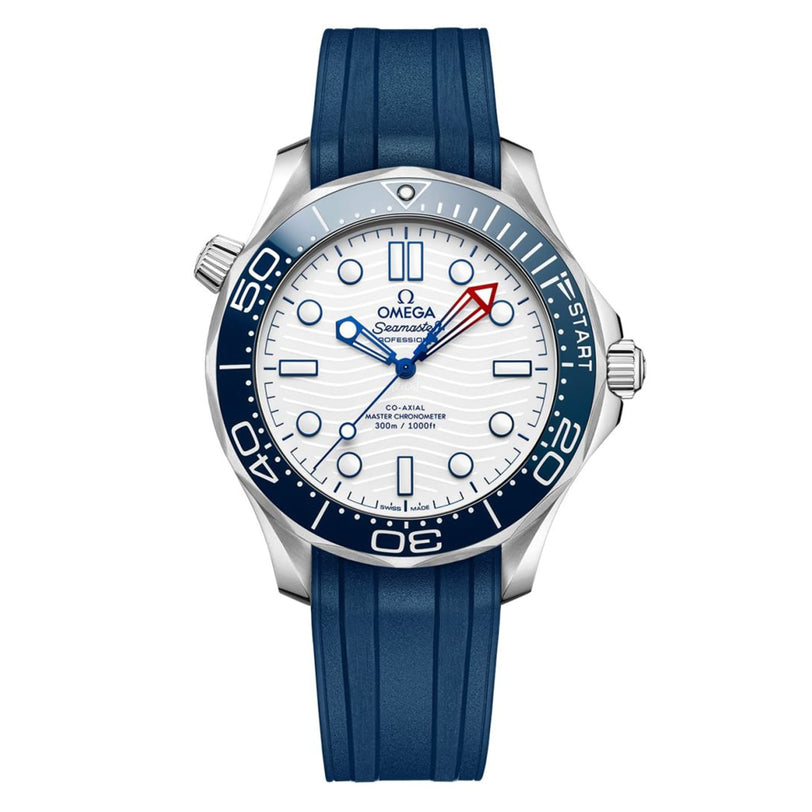The OMEGA Seamaster Diver Americas Cup 300M features a white dial, blue bezel, blue rubber strap, and red-tipped seconds hand, powered by the Co-Axial Master Chronometer Calibre 8806, shown against a white background.
