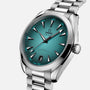 A close-up of the OMEGA Seamaster Aqua Terra 150M wristwatch featuring a teal dial, silver hour markers, Co-Axial Master Chronometer movement, date at 6 o’clock, and a stainless steel bracelet—reflecting its maritime heritage.