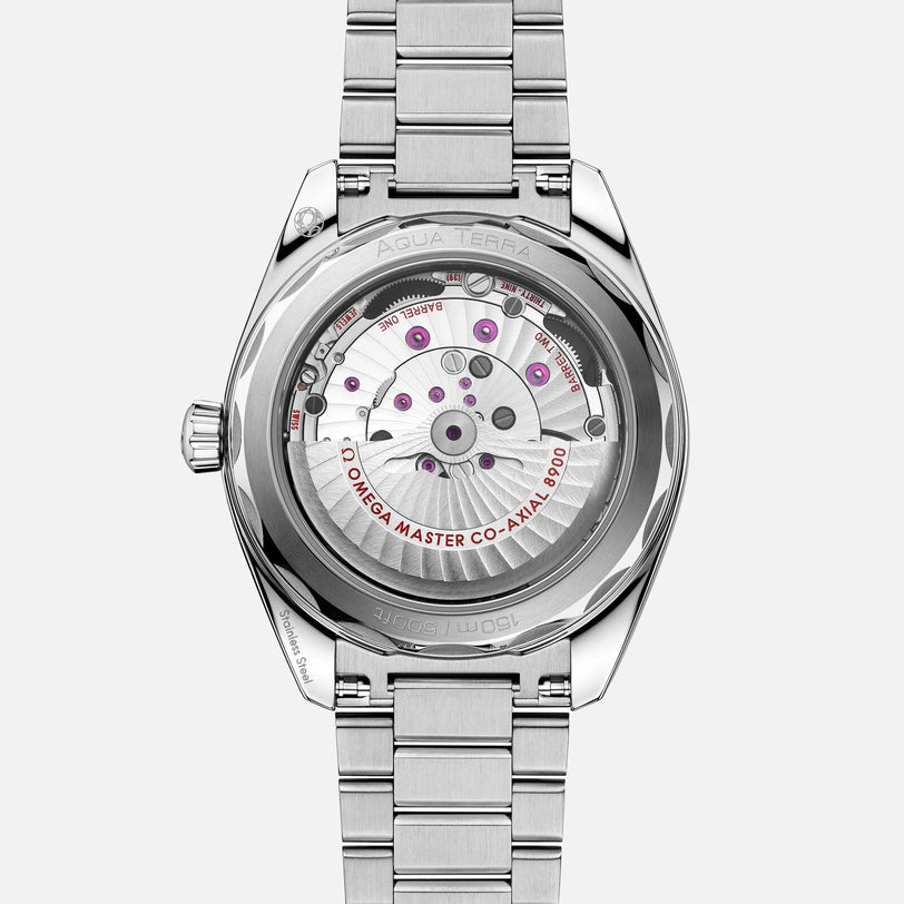 The image displays the back of an OMEGA Seamaster Aqua Terra 150M, featuring a stainless steel exhibition caseback that reveals the automatic Co-Axial Master Chronometer 8900 movement and highlights its maritime heritage.