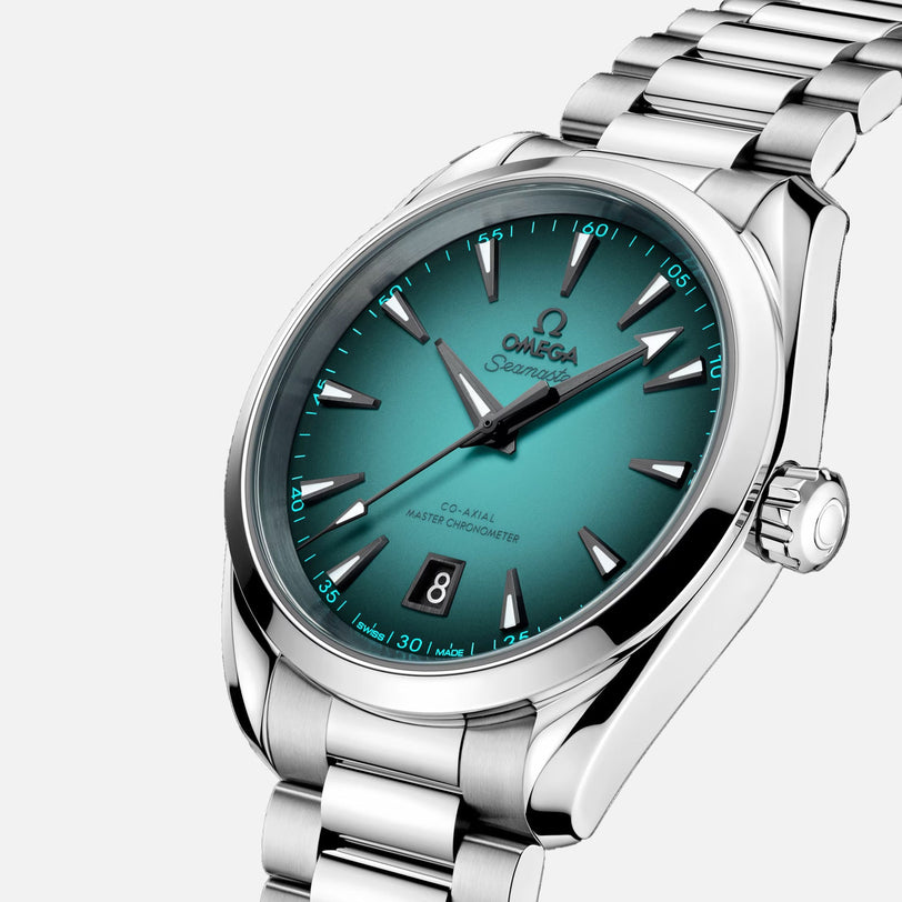 An OMEGA Seamaster Aqua Terra 150M wristwatch with a teal gradient dial, silver hour markers, date at 6 o’clock, Co-Axial Master Chronometer Calibre 8800, and a stainless steel bracelet is displayed on a white background.