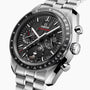 Close-up of the OMEGA Speedmaster Moonphase featuring a stainless steel band, black textured dial, chronograph subdials, and a bezel marked Tachymètre.