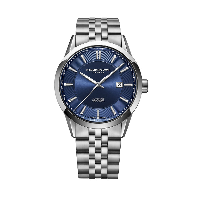 The Raymond Weil Freelancer Automatic features a blue dial, silver hour markers, date display at 3 o’clock, and a stainless steel link bracelet—showcasing Swiss watchmaking excellence.