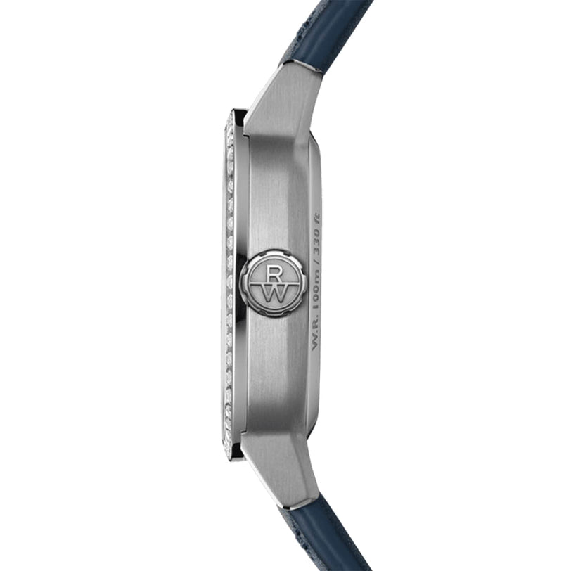 Side view of the Raymond Weil Freelancer Automatic 60 Diamonds Blue Dial wristwatch with a silver cushion-shaped case, textured crown, engraved logo, blue leather strap, and Swiss-made movement against a white background.