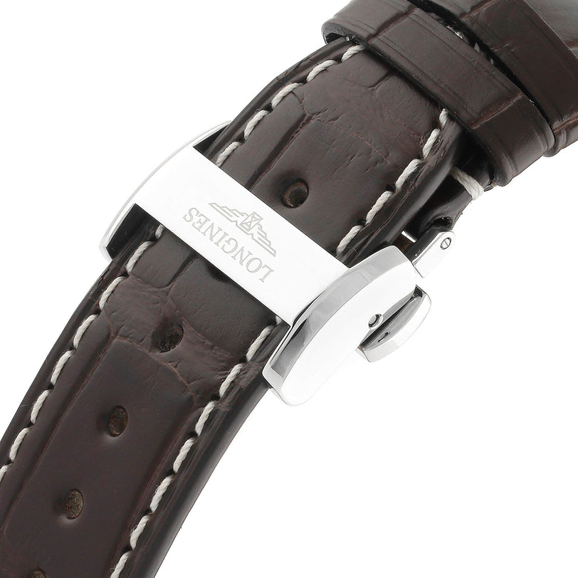 Close-up of a brown leather strap with white stitching and a silver deployment clasp from Longines, designed for the Master Collection automatic watch with stainless steel case.