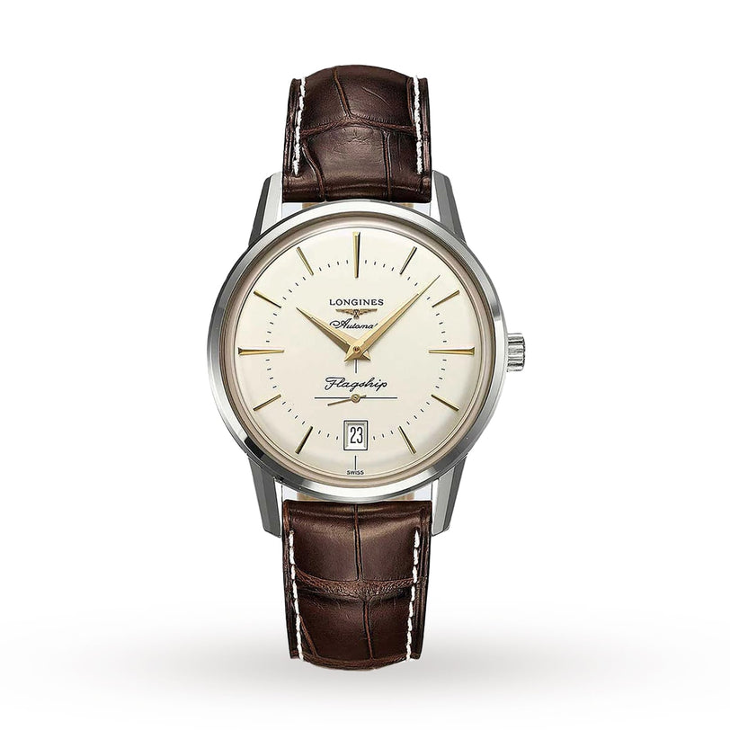 The Longines Flagship Heritage wristwatch features a cream dial, gold hour markers, brown leather strap, date at 6 oclock, and a stainless steel case, displayed on a white background.