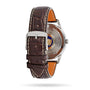 A brown leather strap with a silver buckle is fitted to the Longines Flagship Heritage stainless steel case, shown from the back with visible branding, markings, and the automatic L615 calibre movement.