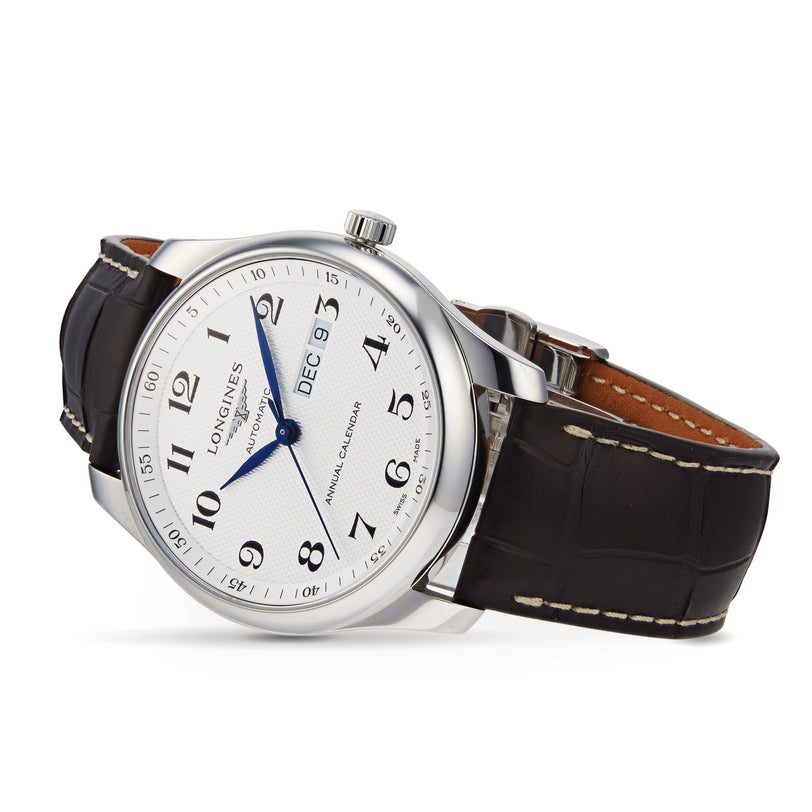 A Longines Master Collection watch with a silver case, white dial, black leather strap, Arabic numerals, blue hands, date display at DEC 9, and powered by the precise L897.2 calibre movement.
