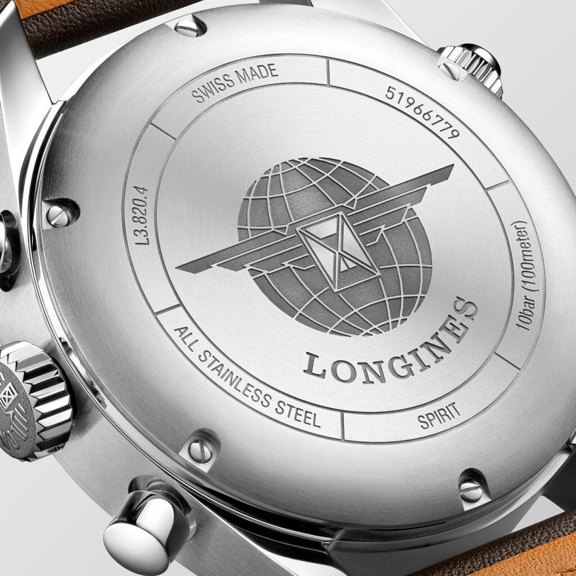 Close-up of a Longines Spirit Chronograph case back displays an engraved globe logo, SWISS MADE text, serial and model numbers, water resistance, ALL STAINLESS STEEL SPIRIT, and houses the chronometer-certified L688.4 calibre movement.