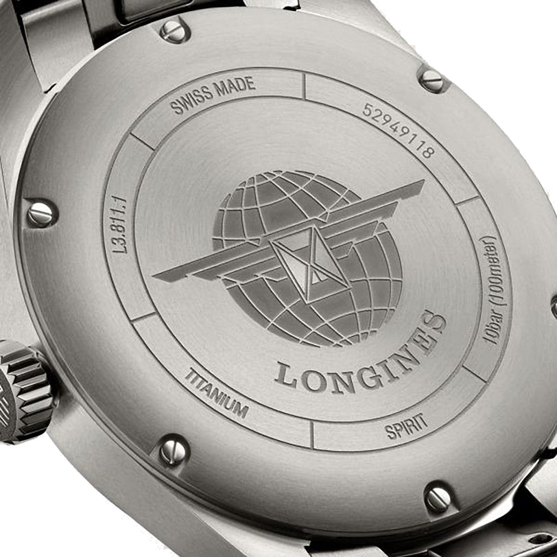 Close-up of the back case of the Longines Spirit watch, featuring the brand logo, an engraved globe, and inscriptions like Swiss Made, Titanium, and serial numbers.