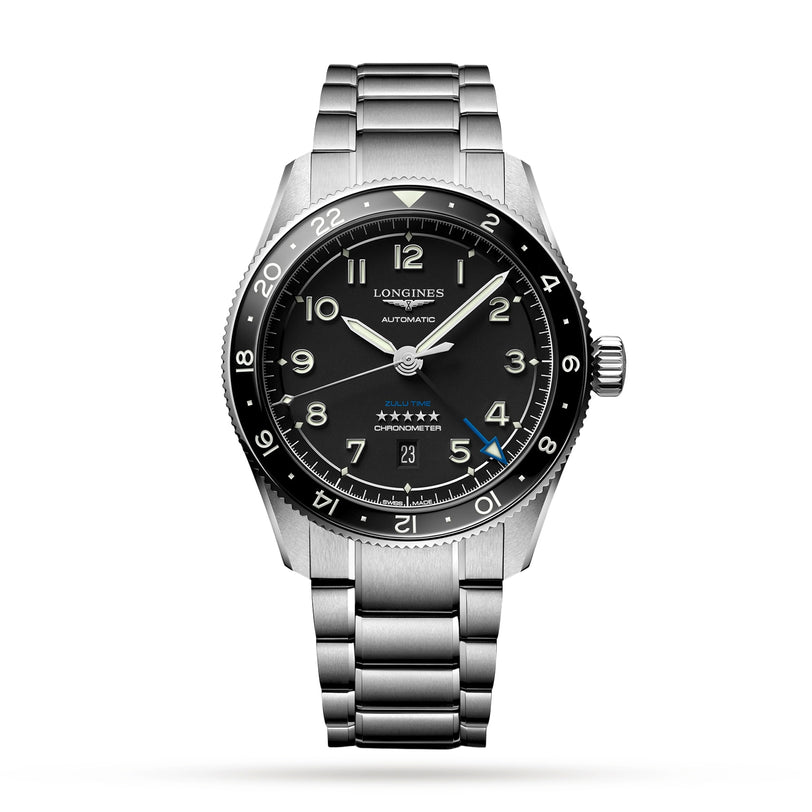 The Longines Spirit Zulu Time stainless steel wristwatch features a black dial with white numerals in Swiss Super-LumiNova, a date window at 6 o’clock, and a brushed case and bracelet, photographed against a white background.