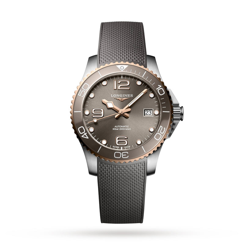 A Longines HydroConquest automatic watch with a grey dial, rose gold bezel, Swiss Super-LumiNova hands, date display, and textured grey strap is displayed against a white background.