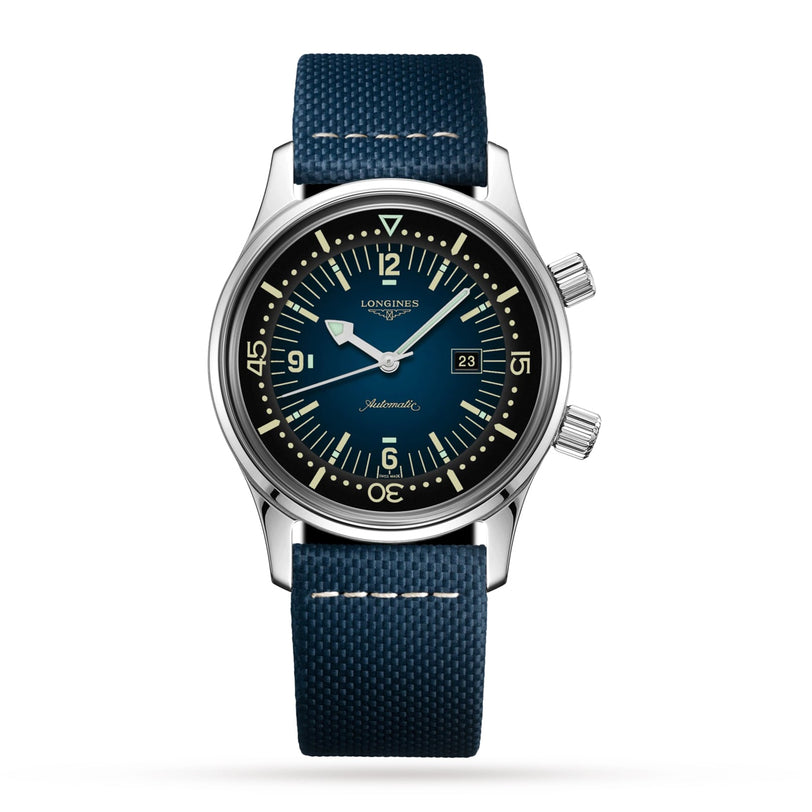 The Longines Legend Diver stainless steel watch features automatic movement, a blue dial, two crowns, a date display, and a textured blue strap, displayed against a white background.