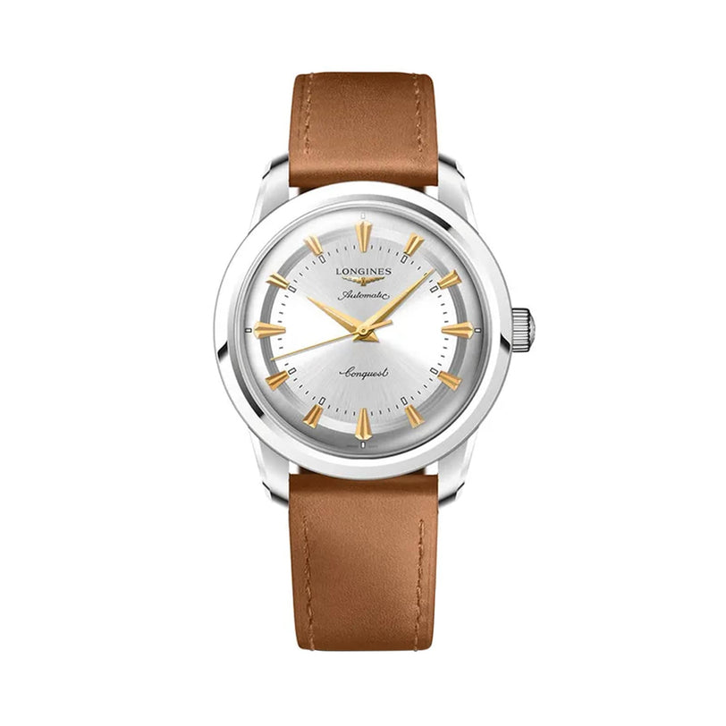 The Longines Conquest Heritage wristwatch features a silver case, white dial, gold markers and hands, and a brown leather strap—a Swiss timepiece renowned for accuracy.