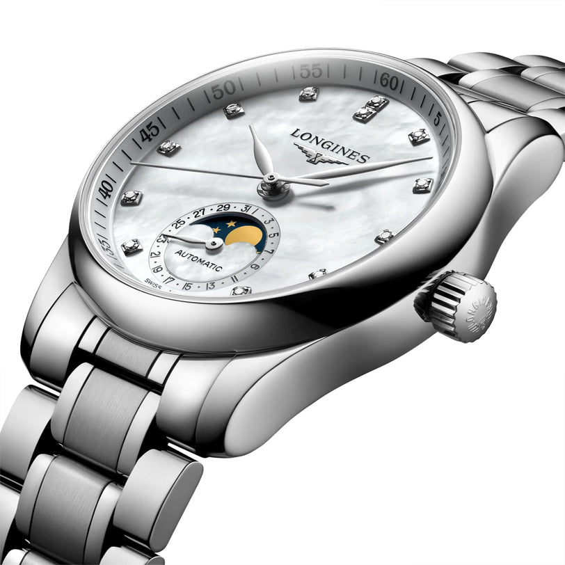 The Longines Master Collection Moonphase is a silver wristwatch with a metal band, diamond indexes, a white dial, moonphase display, and precise automatic movement.