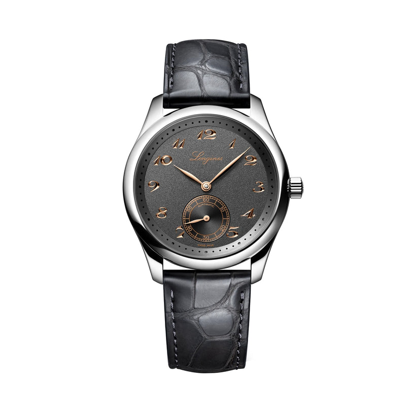 The Longines Master Collection luxury wristwatch features an anthracite dial, gold hour markers, a small seconds subdial, and a black leather strap, displayed on a white background.