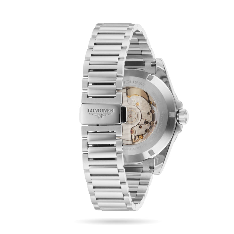 A close-up view of the back of a Longines Conquest stainless steel wristwatch, highlighting the exhibition case back and bracelet clasp displaying the Longines logo.