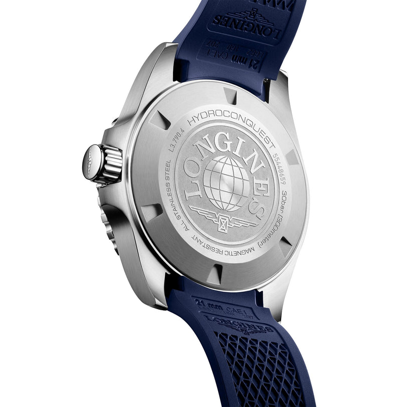Back view of the Longines HydroConquest, showing a stainless steel case back with globe and logo engravings, complemented by a blue textured rubber strap.