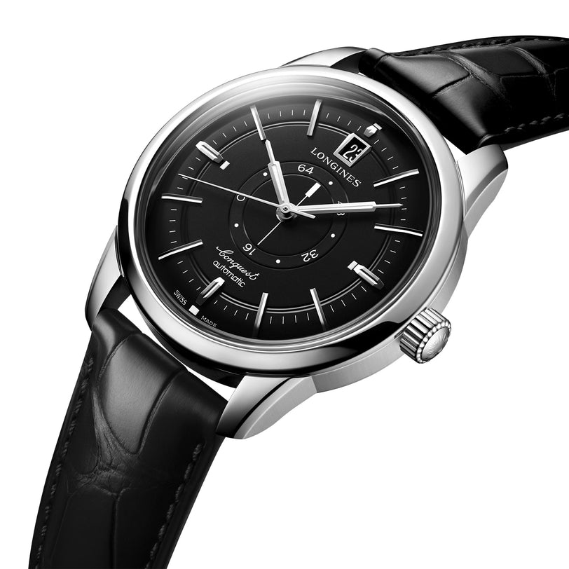 The Longines Conquest Heritage Central Power Reserve features a black dial with date display, stainless steel case, silver hour markers, and a black leather strap, shown at an angle.