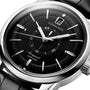 Close-up of the Longines Conquest Heritage Central Power Reserve with a black dial, silver hands and markers, date at 12 o’clock, stainless steel case, and black leather strap.