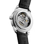Close-up of the Longines Conquest Heritage Central Power Reserve, revealing its automatic calibre movement through a transparent caseback and featuring a black leather strap with a polished stainless steel case.