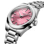 The Longines Conquest features a stainless steel case, metallic pink dial with silver hour markers, date display at 6 o’clock, and automatic self-winding movement.