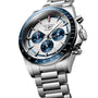 A Longines Conquest Chronograph wristwatch in silver, featuring blue subdials, a tachymeter bezel, stainless steel bracelet, and self-winding movement, displayed at an angle on a white background.