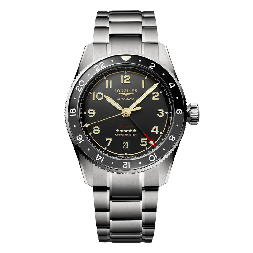 The Longines Spirit Zulu Time is a stainless steel automatic wristwatch featuring a black dial with Arabic numerals, date display, GMT function, and a silver metal bracelet.