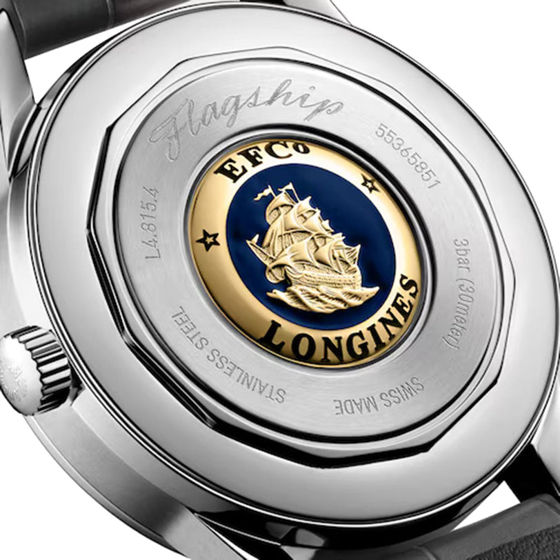 Close-up of the Longines Flagship Heritage Moonphase case back, showing an engraved ship emblem, EFCO LONGINES, model numbers, Stainless Steel, and Swiss Made.