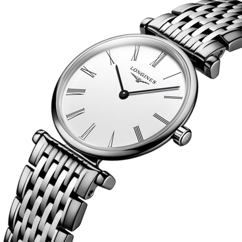 The Longines La Grande Classique de LONGINES wristwatch features a silver case, white dial, black Roman numerals, and a metal link bracelet, highlighting timeless elegance against a white background.