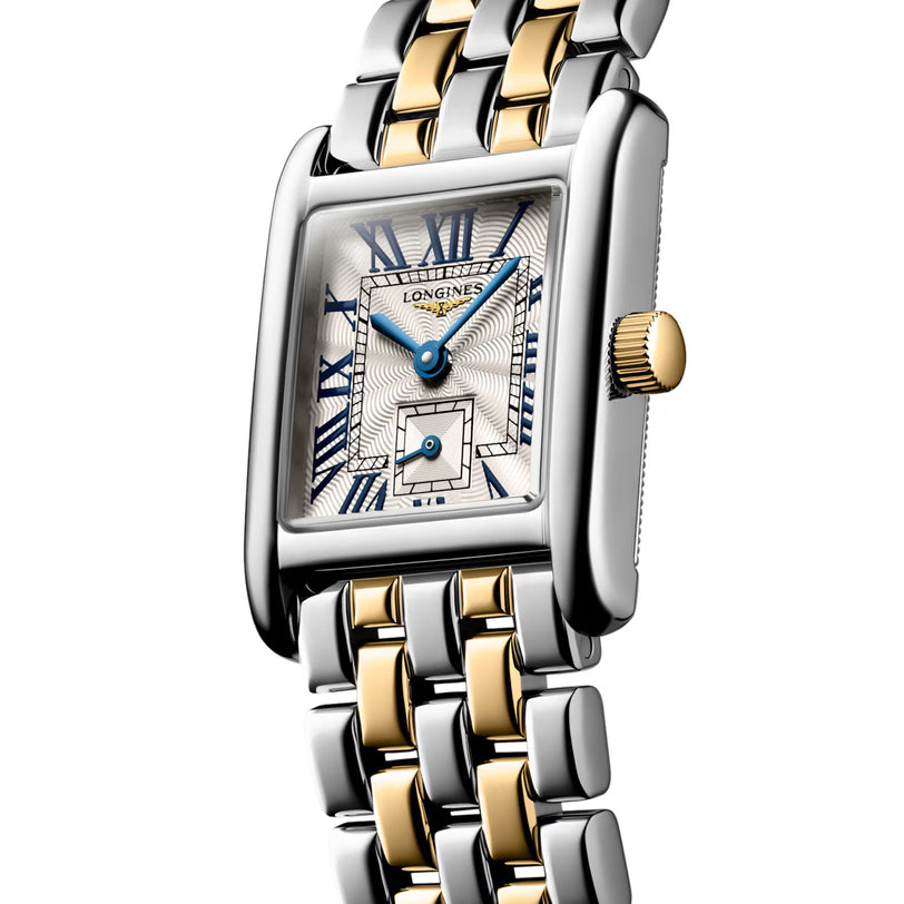 The Longines Mini DolceVita is a rectangular wristwatch with a silver and gold metal bracelet, Roman numeral dial, blue hands, and a gold crown—a modern icon of elegance.