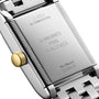 Close-up of the back of a Longines Mini DolceVita watch, highlighting engraved model details and a gold crown—an elegant showcase of modern design.