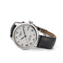 The Tissot Le Locle Powermatic 80 features a silver dial with black Roman numerals, date display at 3 o’clock, Powermatic 80 movement, and a black leather strap.