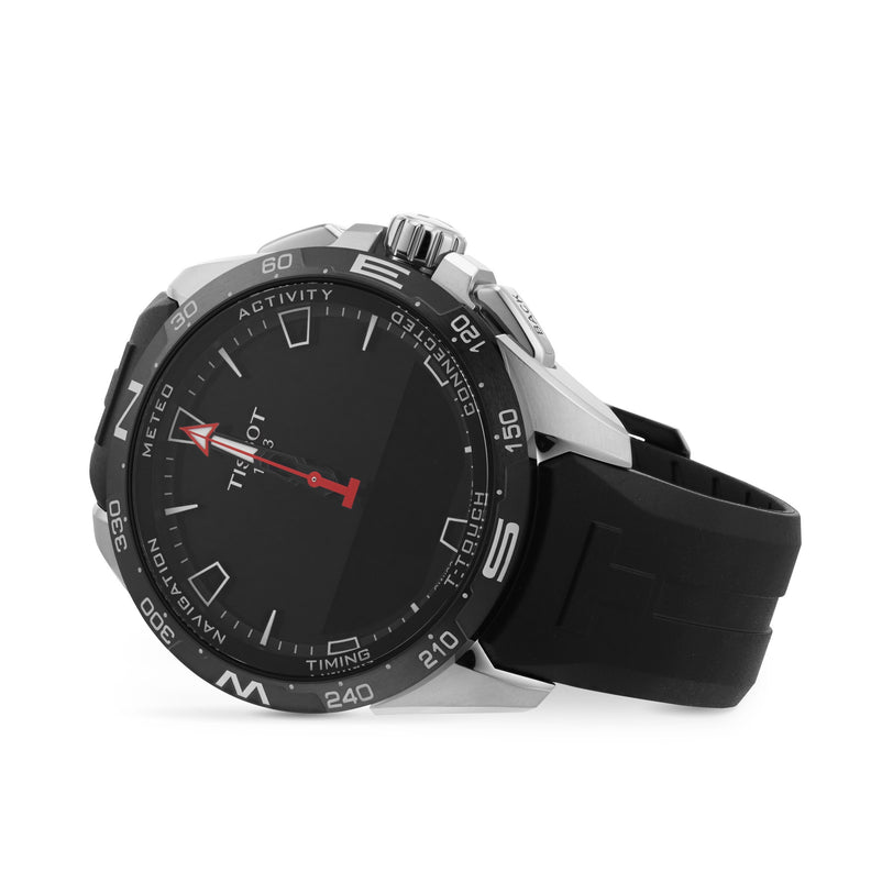 A Tissot T-Touch Connect Solar wristwatch with a round face, titanium case, and black rubber strap in black and silver, shown angled on a white background.
