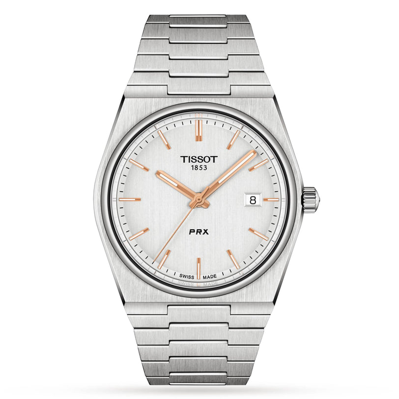 The Tissot PRX is a stainless steel wristwatch with a 1970s-inspired design, silver dial, rose gold markers and hands, date at 3 o’clock, and a metal bracelet.