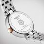 Back view of the Tissot Bellissima Small showing its stainless steel case back with engraved model details, floral design, and water resistance info, all featuring precise Swiss quartz movement.