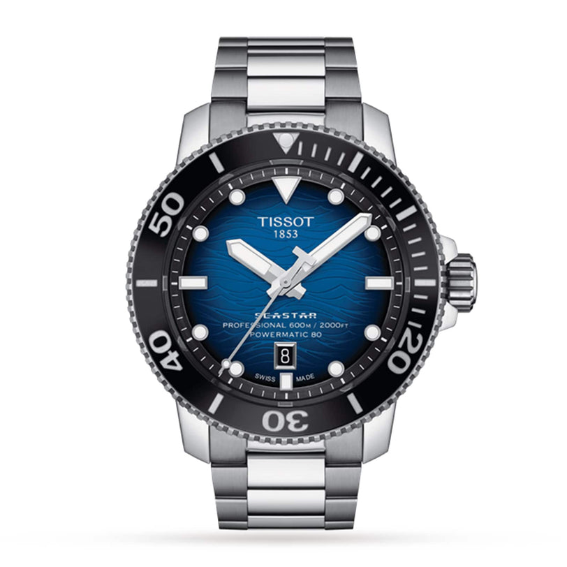 The Tissot Seastar 2000 Professional Powermatic 80 is a stainless steel diver’s watch with a blue dial, black bezel, silver markers, and date at 6 o’clock, shown against a white background.