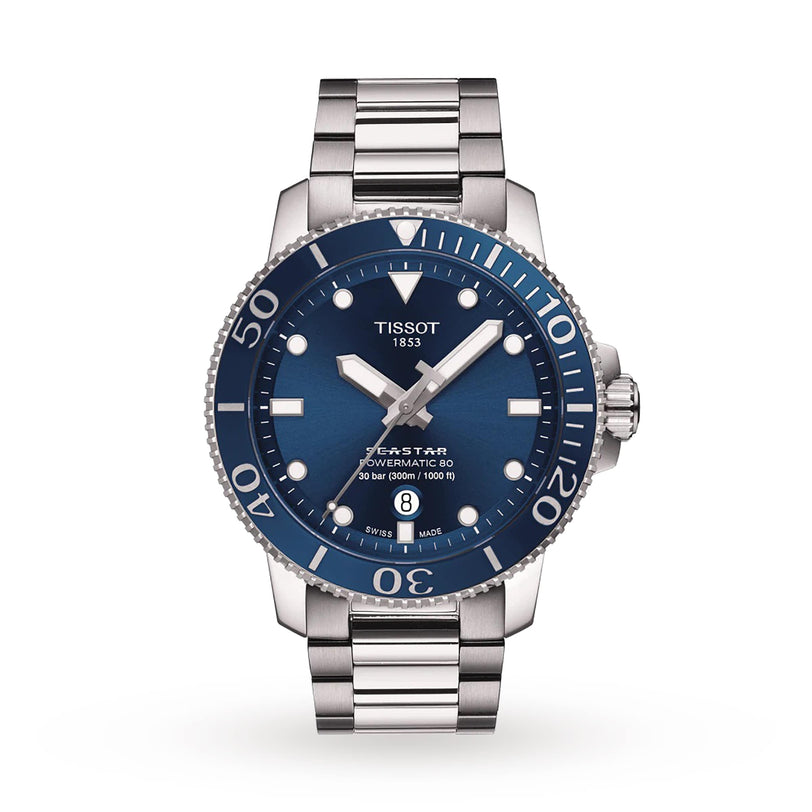 The Tissot Seastar 1000 Powermatic 80 features a stainless steel case, blue dial with white markers, date at 6 o’clock, unidirectional bezel, and Powermatic 80 movement.