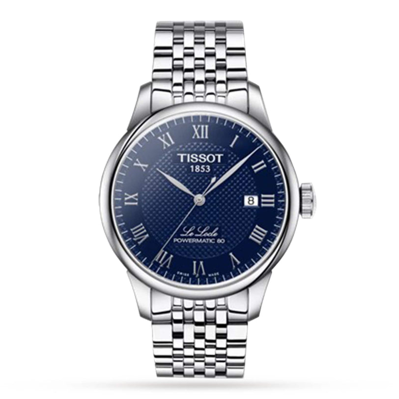 A Tissot Le Locle Powermatic 80 wristwatch featuring a silver metal link bracelet, blue textured dial, Roman numeral markers, and a date window at 3 o’clock.