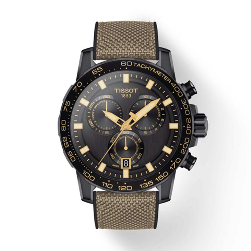 The Tissot Supersport Chrono features a black dial with gold markers, three subdials, Swiss quartz movement, a date window at 6 o’clock, and a khaki fabric strap.