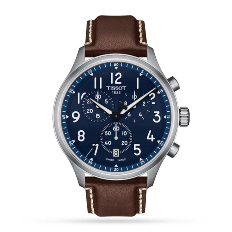 The Tissot Chrono XL Vintage features a blue dial with white numerals, three subdials, a date display at 4 oclock, and a brown leather strap with white stitching for classic style.