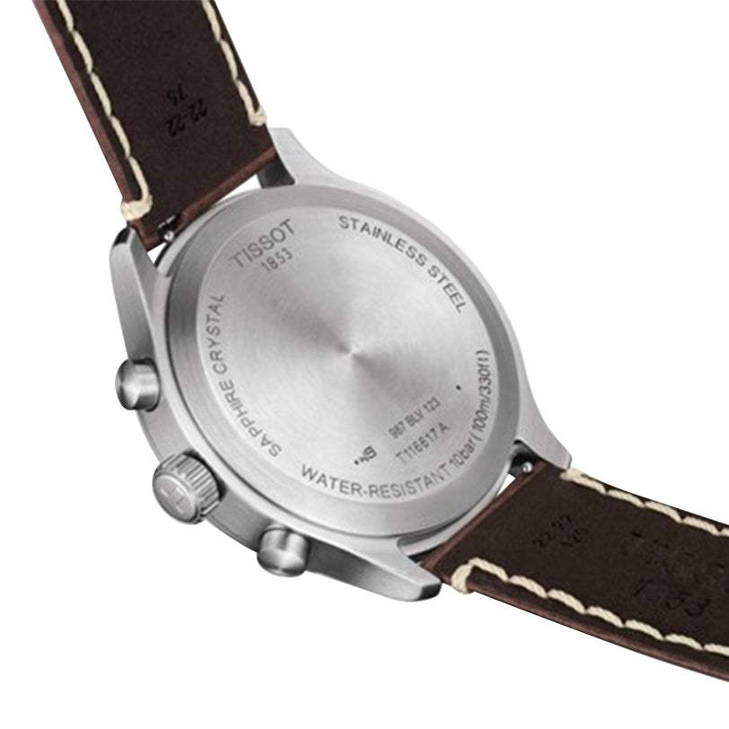 Back view of the Tissot Chrono XL Vintage, featuring a stainless steel case with engraved details and a brown leather strap with white stitching—an elegant timepiece with vintage-inspired design.