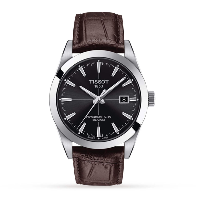The Tissot Gentleman Powermatic 80 Silicium features a black dial, silver indices, date window, and a brown leather strap.
