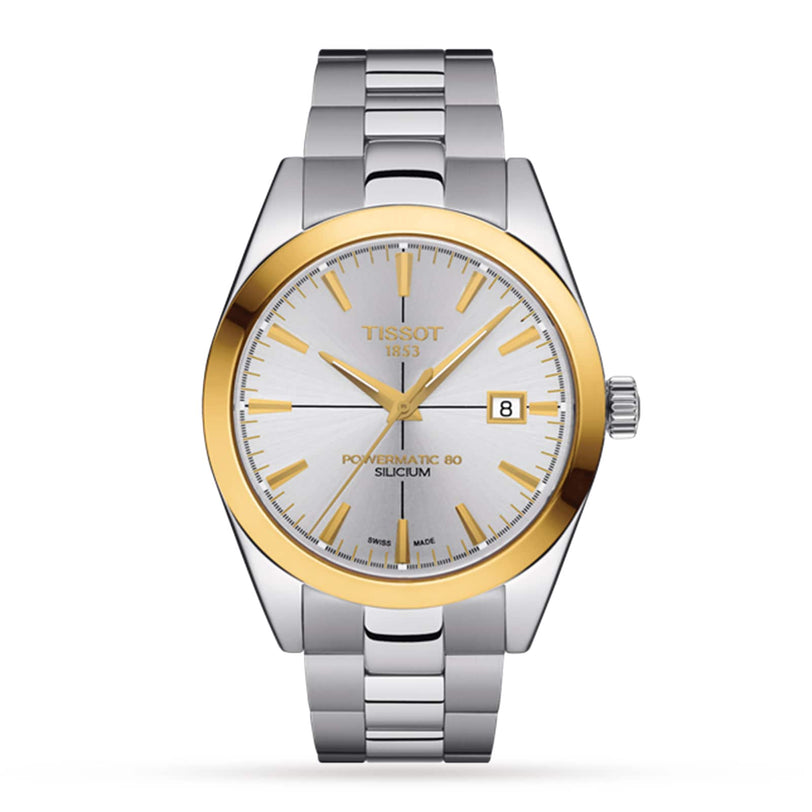 The Tissot Gentleman Powermatic 80 Silicium features a solid 18K gold bezel, silver dial, gold hour markers, date at 3 o’clock, and a silver metal link bracelet.