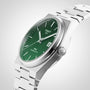 The Tissot PRX Powermatic 80 features a stainless steel case, metal link bracelet, green textured dial with silver hands, date display, and Tissot 1853 branding—a standout wristwatch from Tissot.
