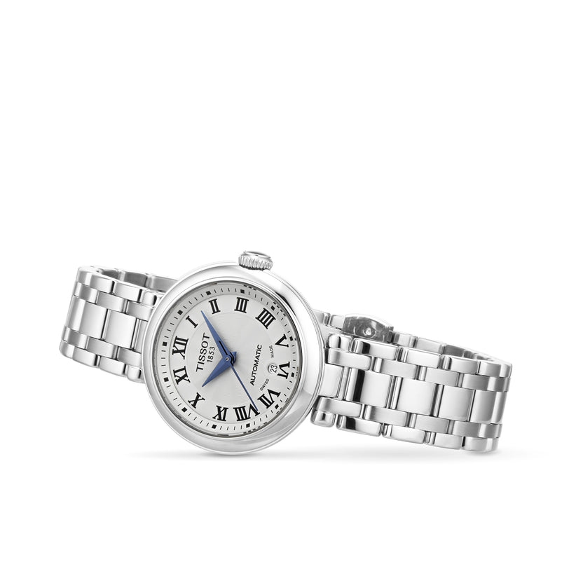 Tissot Bellissima Automatic wristwatch with Roman numerals and a metal link band, displayed on a white background.