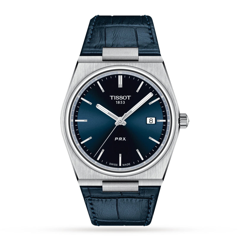 The Tissot PRX features a blue dial, silver-tone case, Swiss quartz movement, date at 3 o’clock, and a blue leather strap—an elegant 1970s-inspired wristwatch perfect for any occasion.