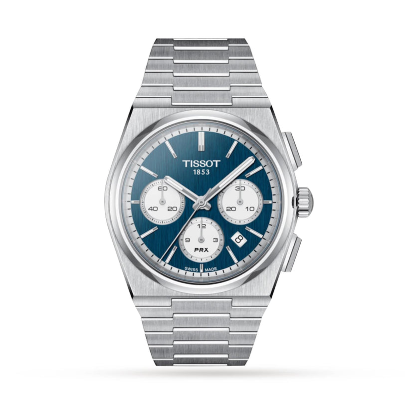 The Tissot PRX Automatic Chronograph features a 1970s-inspired stainless steel case, blue dial with three subdials, date display, and silver markers on a metal link bracelet—ideal for luxury watch enthusiasts.