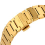 Close-up of a gold metal Tissot PRX Powermatic 80 watch band, featuring TISSOT 1853 engraved on the clasp and showcasing its elegant design.